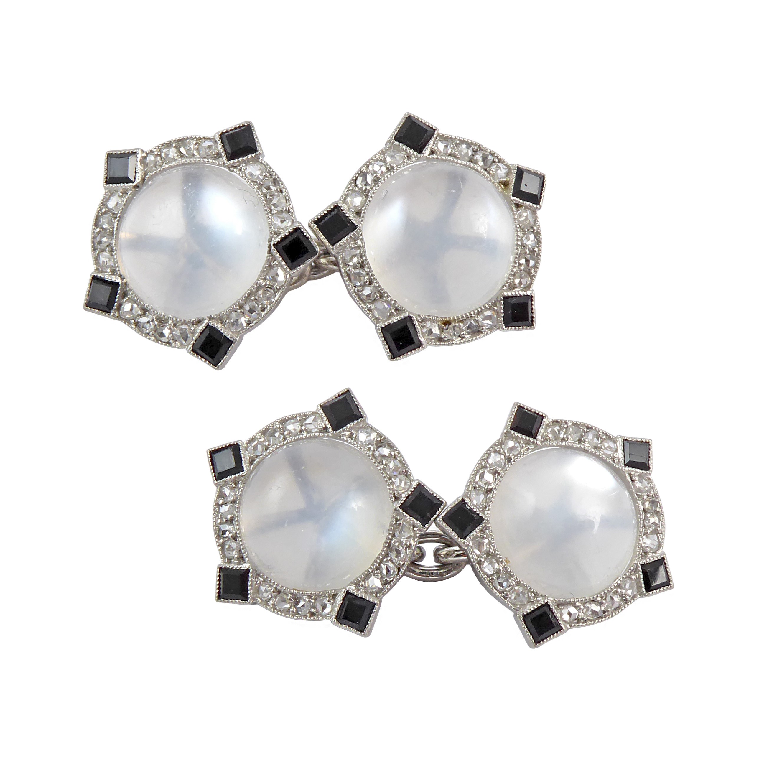 Pair of Art Deco cabochon moonstone, diamond and onyx cufflinks by Cartier c.1925, of stylised Tudor rose design,